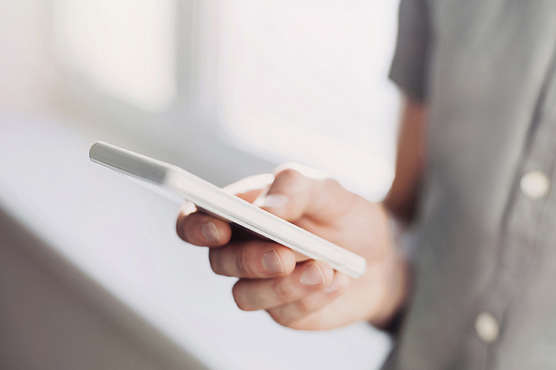 Young man using smart phone