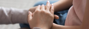 Child Support Mom holding child's hand
