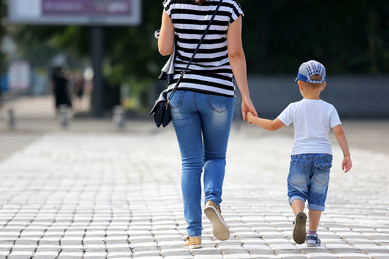 Pedestrians cross a street