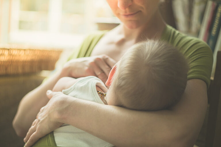 Mother breastfeeding her child